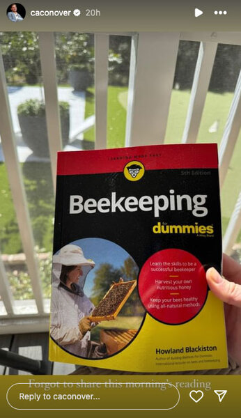 Craig Conover showing off his beekeeping book.