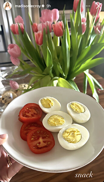A plate of hard boiled eggs and tomato slices prepared by Madison LeCroy.