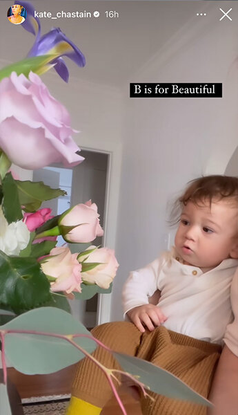 Kate Chastain of Below Deck posts a baby admiring flowers on her Instagram story.