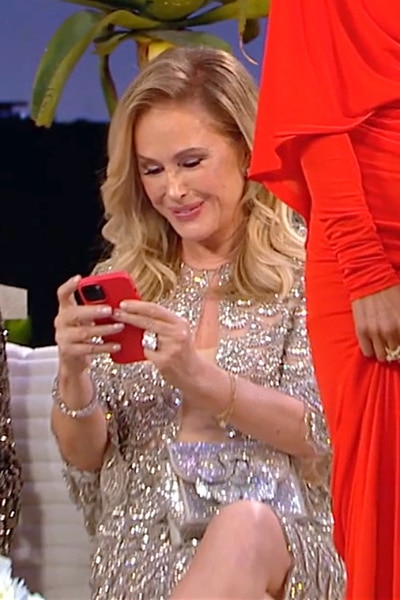 Kathy Hilton on her phone at the RHOBH Season 13 reunion.