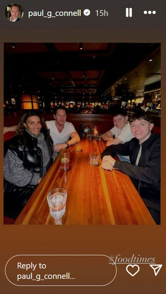 Paul Connell and Dolores Catania and his sons at a restaurant.