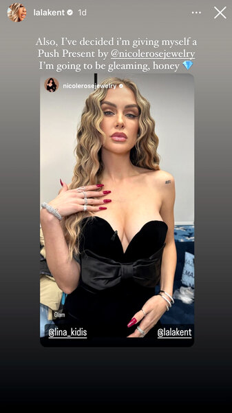 Lala Kent wearing a black strapless top and showing her red manicure