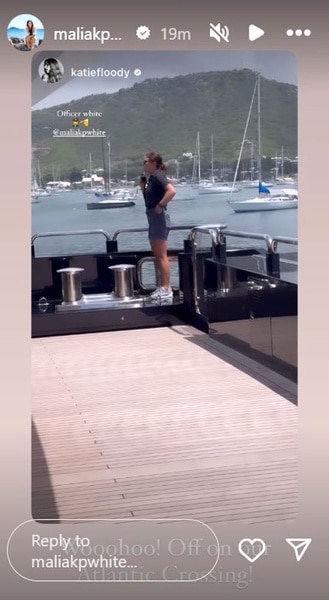 Malia White on a yacht talking into a walkie talkie.
