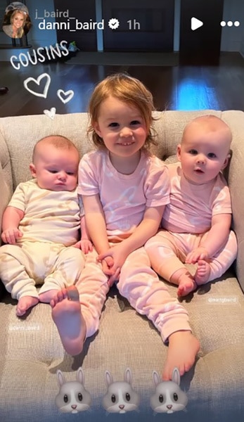 Danni Baird's baby and cousins sitting on a couch together.