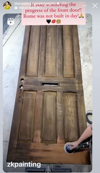 Margaret Josephs wood door being renovated to be installed in her home.