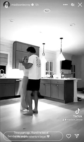 Madison LeCroy and her husband Brett Randle dance in the kitchen.