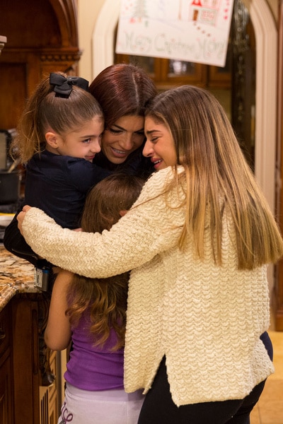 Teresa Giudice hugging her daughters.