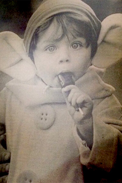 James Kennedy as a baby with a lollipop in his mouth
