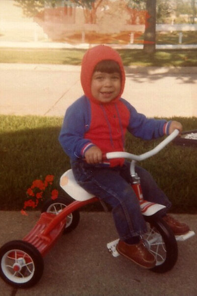 Jax Taylor rides a tricycle as a young boy.