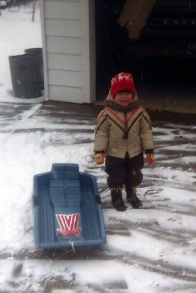 Jax Taylor stands outside in the snow as a little boy.