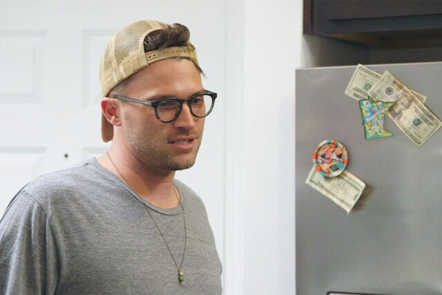 Tom Schwartz looks distressed in front of his refrigerator during an episode of Vanderpump Rules
