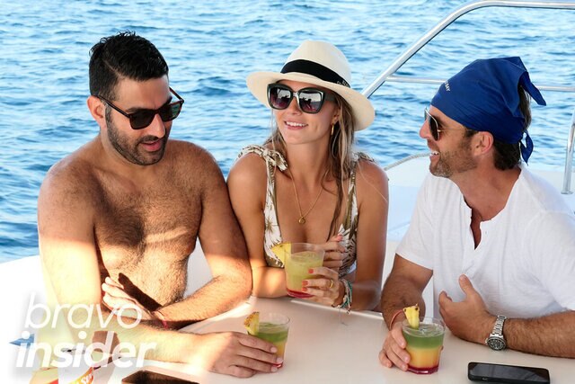 Rod Razavi, Taylor Anne Green, and Jarrett Thomas having some drinks on a yacht.