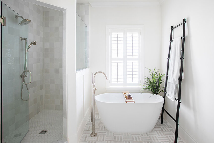 Madison LeCroy's bright, all white, bathroom with a soaking tub and a walk in shower.