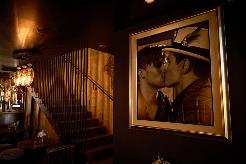 Wall art of the Toms' kissing inside of Tom Tom.