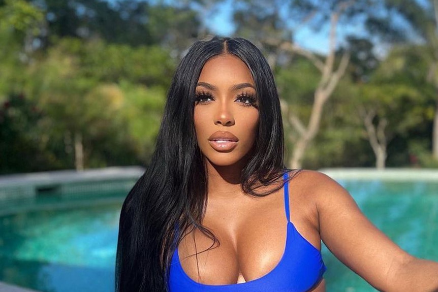 Porsha Williams poolside in a swimsuit.