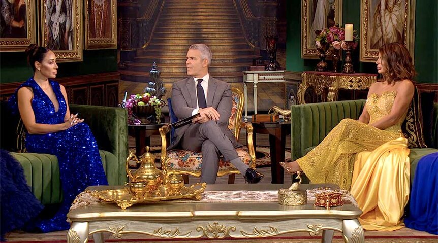 Melissa Gorga, Andy Cohen and Teresa Giudice sitting on the couches of the set of the Real Housewives of New Jersey Season 13 Reunion