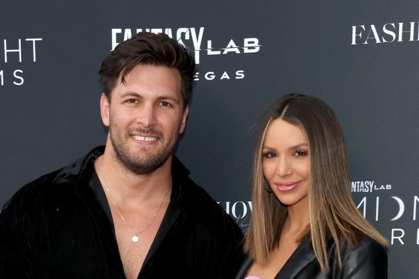 Scheana Shay and Brock Davies pose together on a red carpet.
