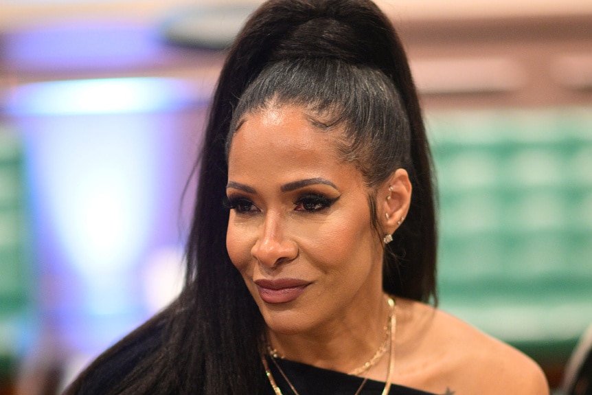 A photo of Sheree Whitfield wearing a high ponytail.