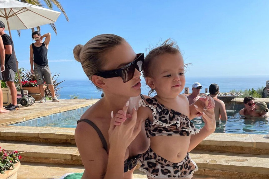 Lala Kent and Ocean Emmett in bathing suits by a pool.