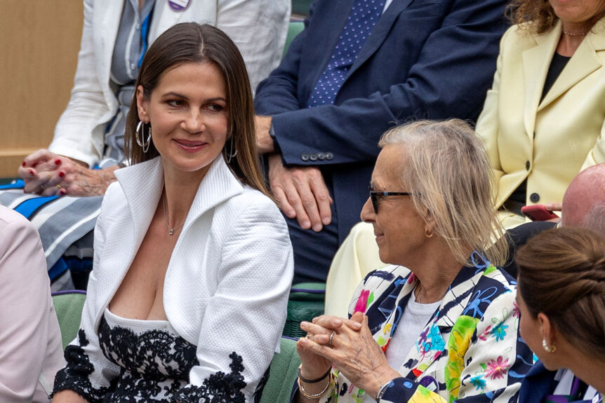 Julia Lemigova and Martina Navratilova having a conversation with Kate Middleton at Wimbledon