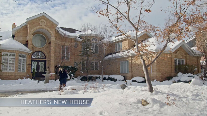 The exterior of Heather Gay's home during the winter with snow on the lawn.