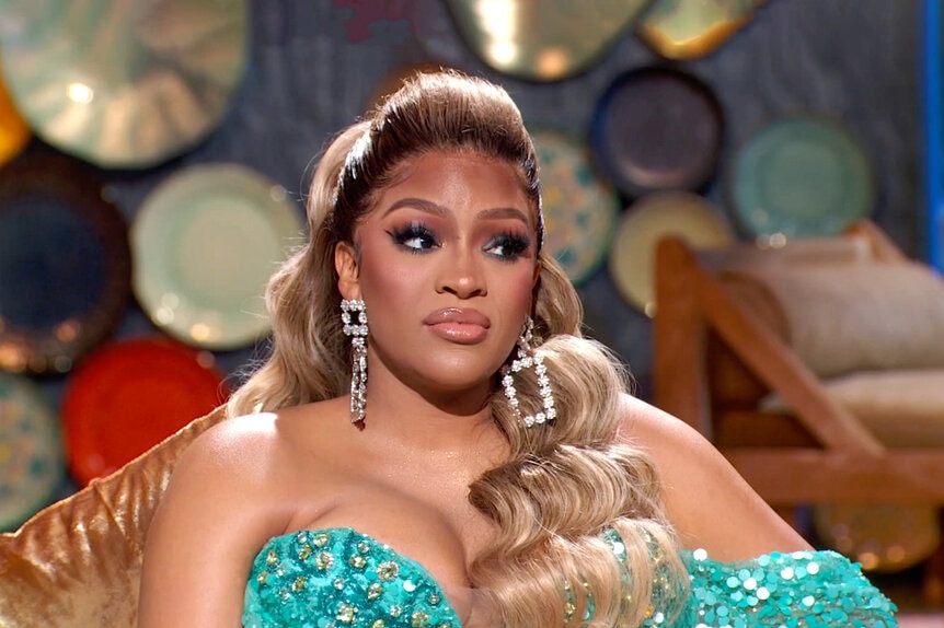 Drew Sidora in full glam in a blue gown while filming the Real Housewives of Atlanta Reunion.