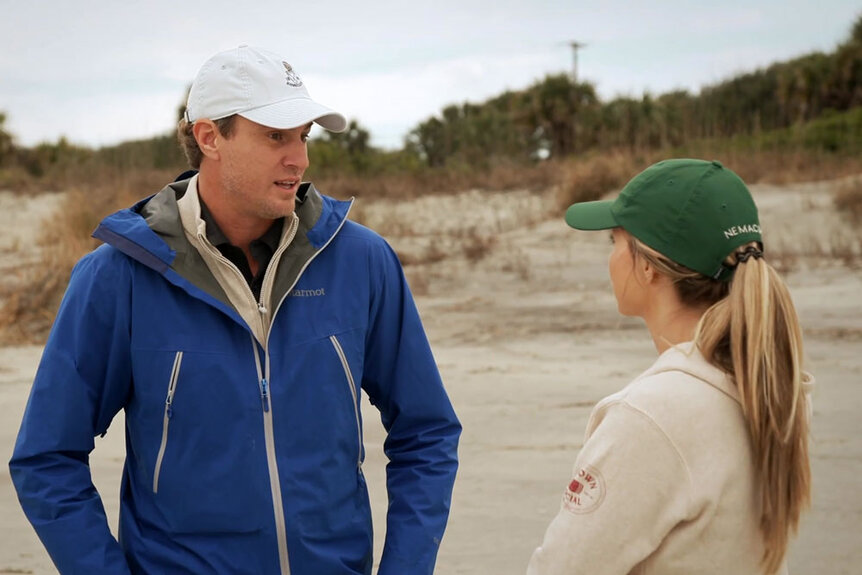 Shep Rose and Taylor Ann Green having a conversation on a beach in Charleston while filming Season 9 of Southern Charm.