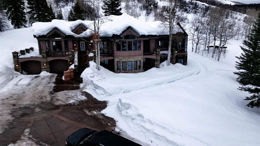 The exterior of the Winter House vacation home surrounded by snow in Steamboat Springs, Colorado.