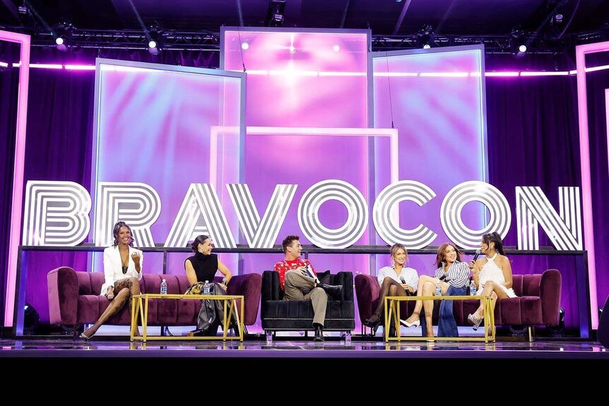 Bravolebrities sit on stage during BravoCon 2023.