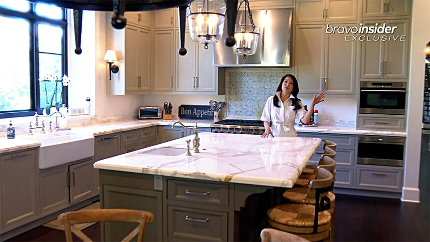 Crystal Kung Minkoff standing in her home kitchen.