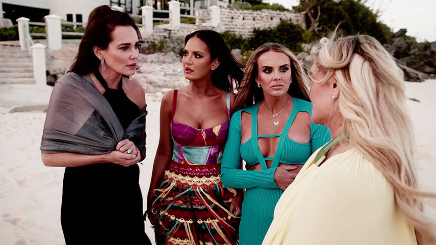 Meredith Marks, Lisa Barlow, Whitney Rose, and Heather Gay talk on a beach in Bermuda.