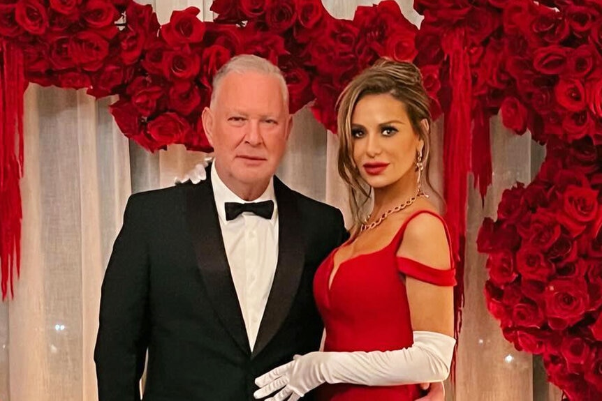 Dorit Kemsley and Paul "PK" Kemsley pose together while dressed in fancy outfits.