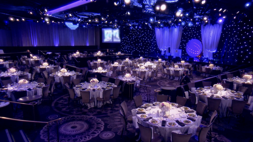 Tables and a stage set for Dorit Kemsley's Homeless Not Toothless Gala featured in The Real Housewives of Beverly Hills 1312.