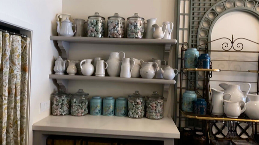 The interior of Something About Her featuring teas, candies, and vessels.