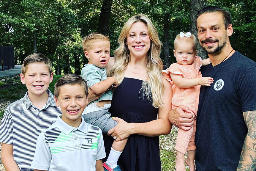 Briana Culberson posing outdoors with Ryan Culberson and their kids.