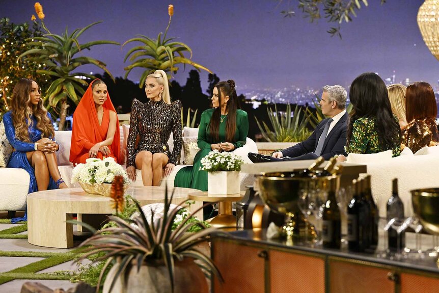 Annemarie Wiley, Dorit Kemsley, Erika Jayne, Kyle Richards, and Andy Cohen discuss in front of a Beverly Hills themed set during the Season 13 Reunion.