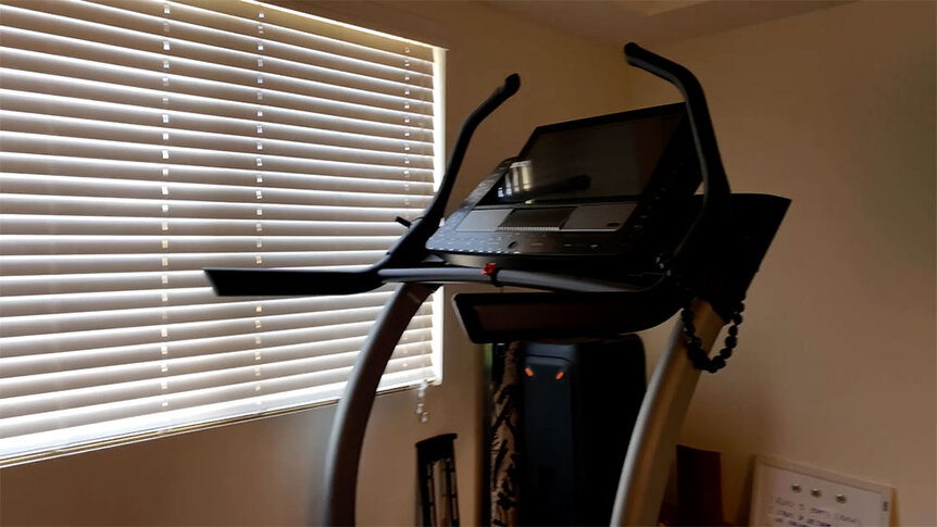 Tom Schwartz's bedroom with a treadmill.