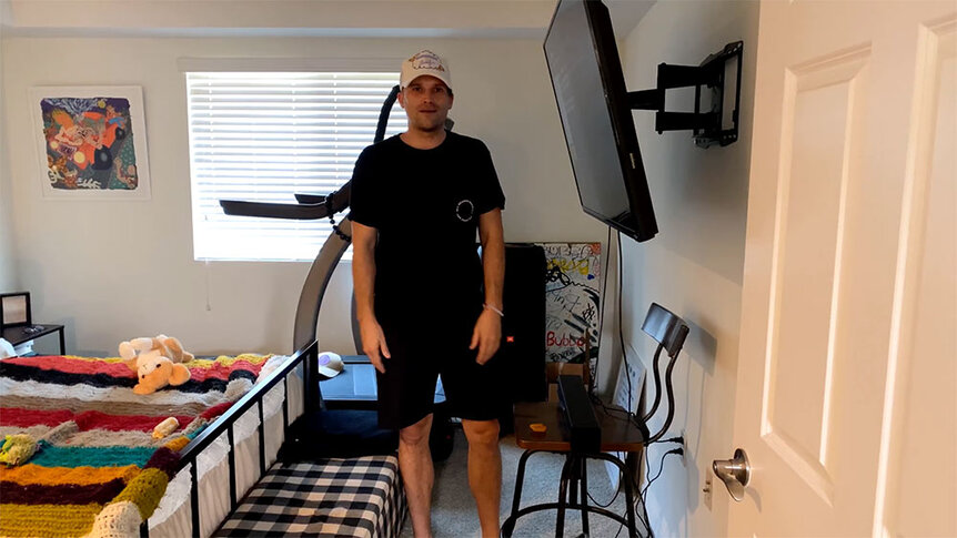 Tom Schwartz standing in his bedroom.