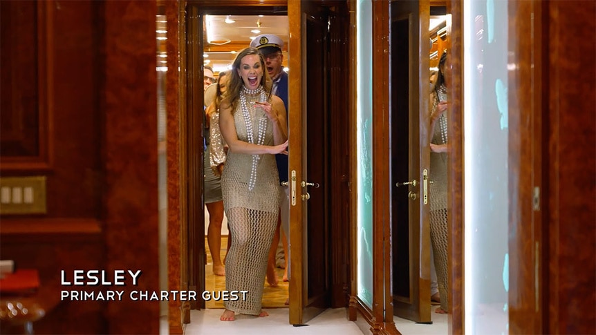 A charter guest looking shocked while entering a guest cabin.
