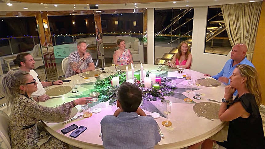 Jill Zarin sits at the dinner table with her charter guests.