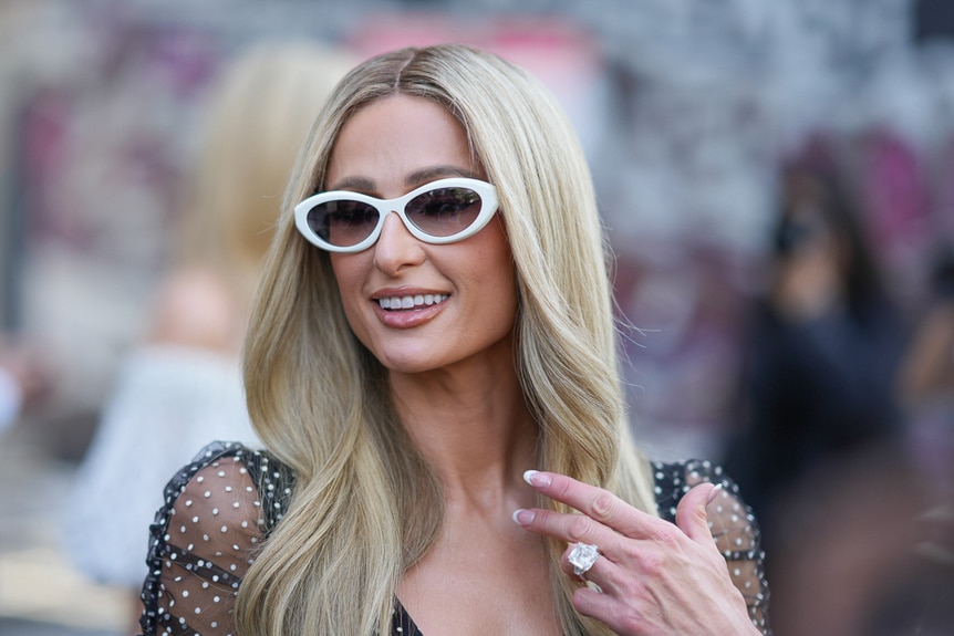 Paris Hilton wearing sunglasses at Paris Fashion week