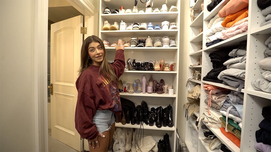 Gia Giudice standing in a closet, showing off her shoes.