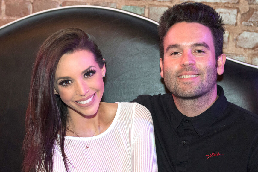 Scheana Shay and Mike Shay sitting at a birthday party together
