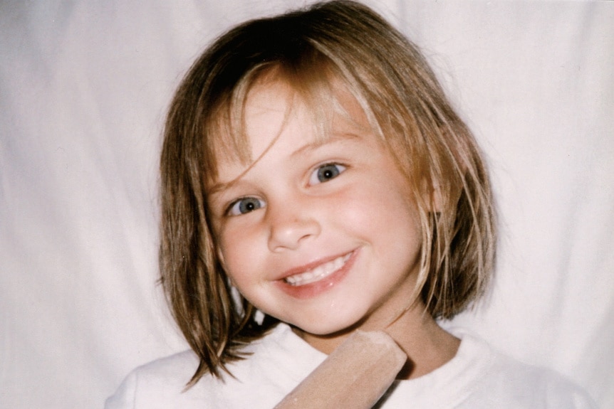 Lala Kent as a little girl, smiling.