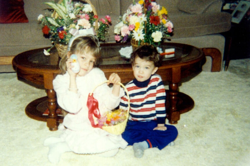 Lisa Hochstein and another child holding an Easter basket.