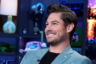 Craig Conover smiling while sitting at the WWHL clubhouse.